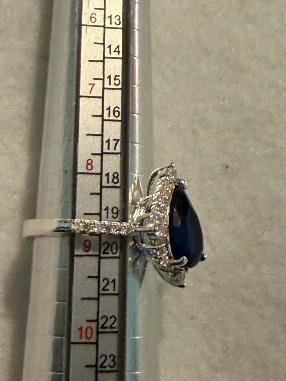 Silver Ring with Deep Blue Teardrop Stone and Pavé Accents